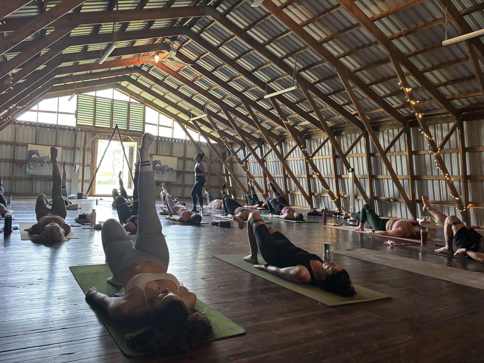 Guests in a restorative posture on mats in the hayloft at Sherwood Farm during last year's day retreat